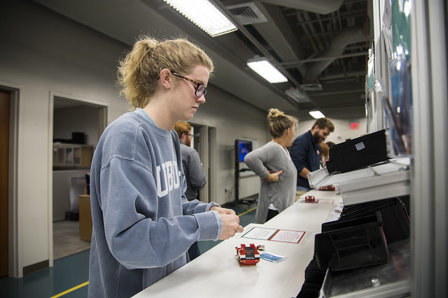 Engineering students are seen working in the Design and Manufacturing Laboratory.