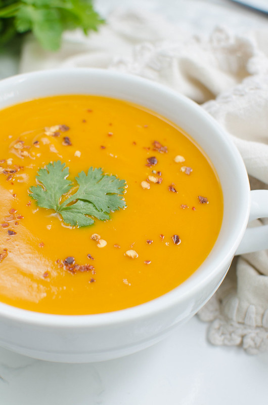 Paleo Coconut Curry Butternut Squash Soup is full of spicy, cozy flavor. And it’s easy enough for a quick weeknight dinner!