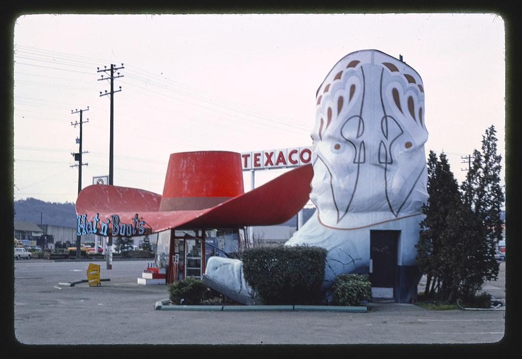 Hat n' Boots gas station (1945), boot restrooms with hat behind them view, 6800 [East] Marginal Way [South], Route 99, Seattle, Washington (LOC) | by The Library of Congress