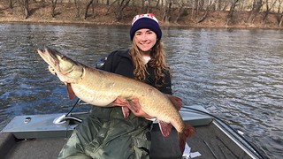 Photo of Mackenzie Peperack with a 46-inch long muskellunge she caught