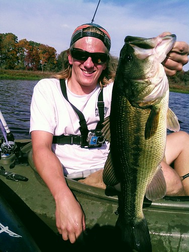 Photo of Angler holding up a largemouth bass