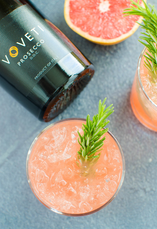 Grapefruit Rosemary Sparkler - the perfect holiday or New Years Eve cocktail! Fresh grapefruit juice, easy homemade rosemary simple syrup, and prosecco. 
