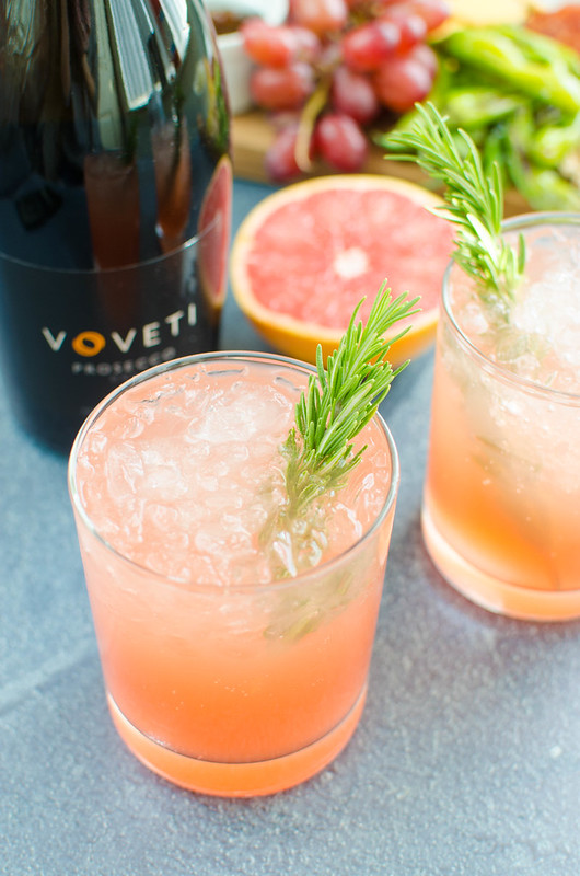 Grapefruit Rosemary Sparkler - the perfect holiday or New Years Eve cocktail! Fresh grapefruit juice, easy homemade rosemary simple syrup, and prosecco. 
