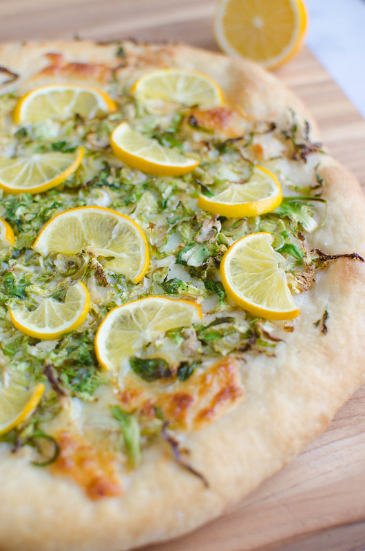 Meyer Lemon Brussels Sprouts Pizza - my favorite savory way to use meyer lemons! Pizza with mozzarella, romano cheese, shredded brussels sprouts, and sliced meyer lemons. 