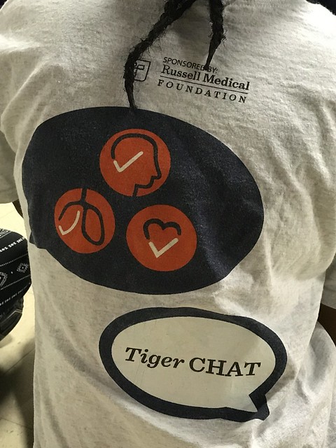 The back of a T-shirt for TigerCHAT.