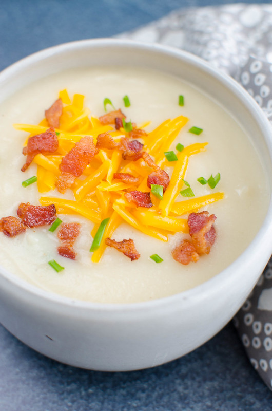 Loaded Baked Potato and Cauliflower Soup - creamy potato and cauliflower soup with bacon, cheddar cheese, and green onions. A lightened up version of baked potato soup!