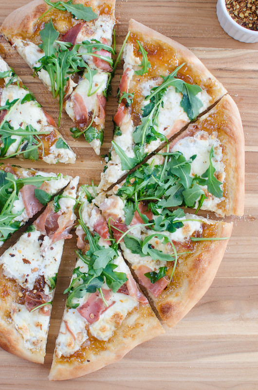 Fig, Burrata, and Prosciutto Pizza - sweet fig jam, salty prosciutto, and creamy burrata! Topped with fresh arugula and crushed red pepper flakes. 
