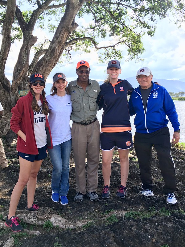 Dr. Jenda with Masamu attendees from Auburn standing in front of a tree