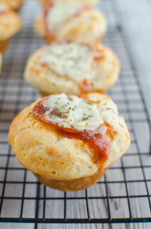 Pizza Muffins - only 5 ingredients! Canned biscuits pressed into a muffin tin and filled with pizza sauce, pepperoni, and cheese! Kids love these!