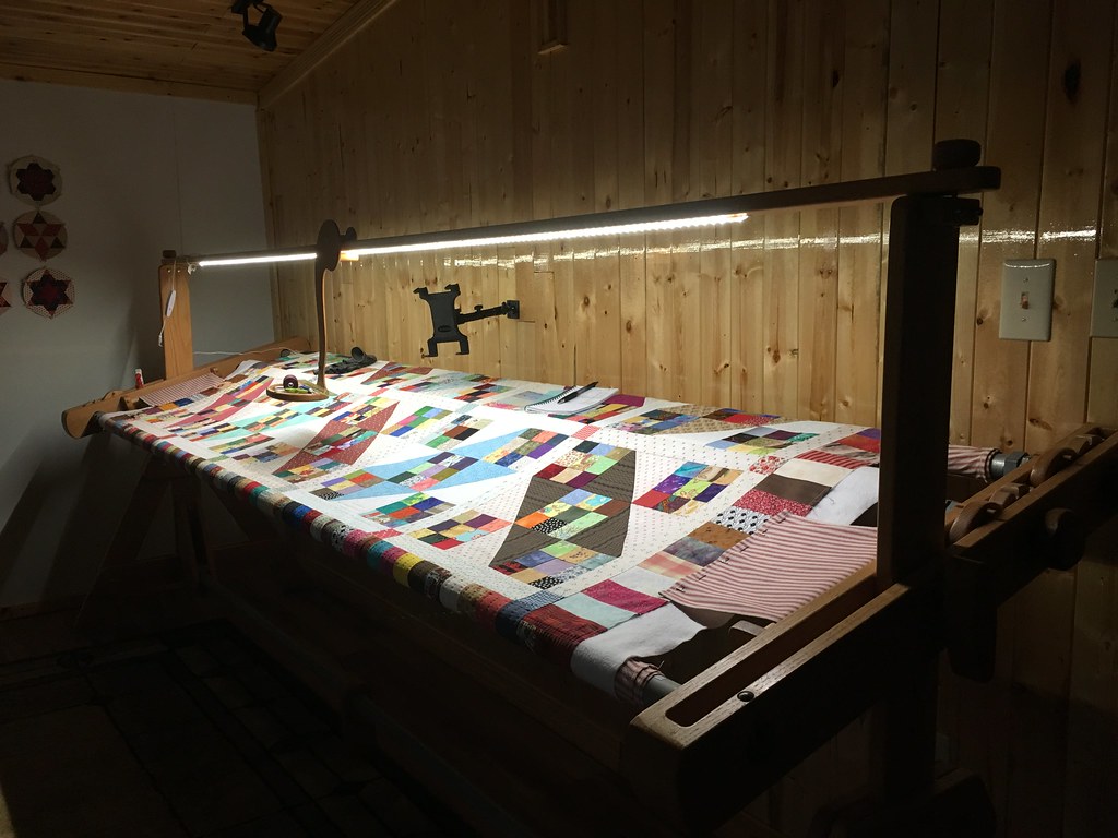 Lighted quilting frame loaded with quilt top, batting and backing; March 5, 2018 (Apple iPhone 6s)