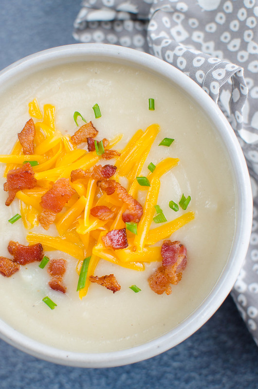 Loaded Baked Potato and Cauliflower Soup - creamy potato and cauliflower soup with bacon, cheddar cheese, and green onions. A lightened up version of baked potato soup!
