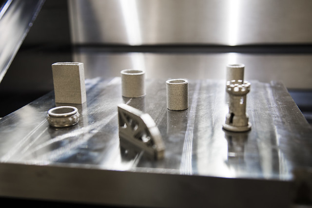Complex metal parts made using a 3-D printer are shown