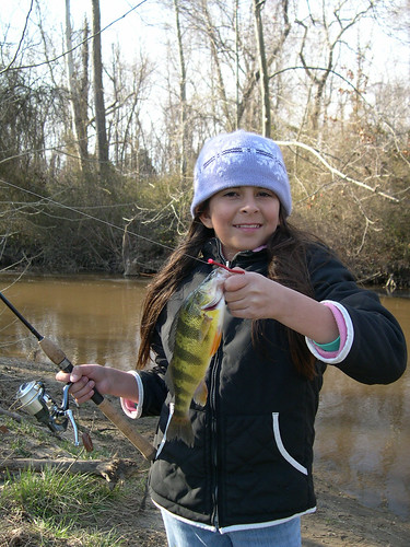 Photo of happy girl with yellow perch