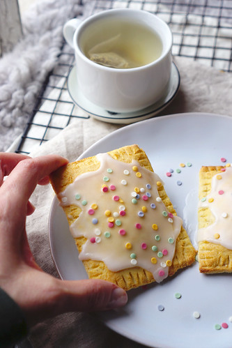 Homemade gluten free pop tarts made with a low carb coconut shortcrust pastry and decorated with icing and Waitrose fruity confetti.