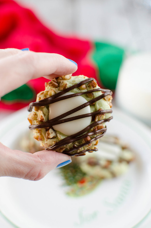 Pistachio Thumbprint Cookies - pistachio cookies with vanilla filling and a chocolate drizzle! The perfect Christmas cookie!
