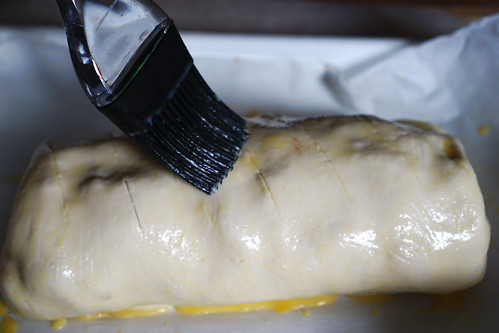 How to make a gluten free apple and walnut strudel: brushing an egg wash over the pastry