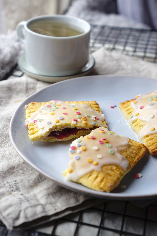 Homemade gluten free pop tarts made with a low carb coconut shortcrust pastry and decorated with icing and Waitrose fruity confetti.