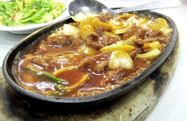 Nice House sizzling beef on a hot plate
