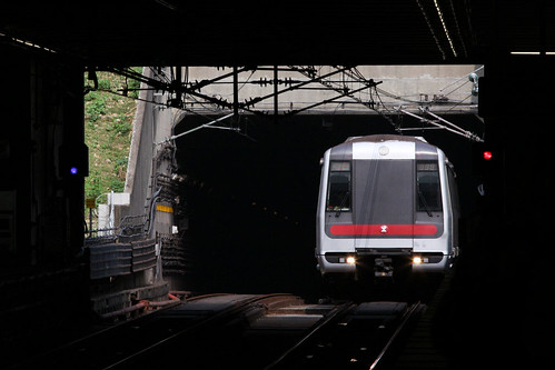 Southbound train emerges from the tunnel at Kwai Hing station