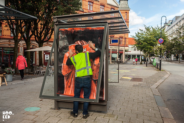 Adbusting with street artist NDA on the streets of Stavanger, Norway