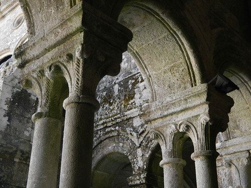 Stone columns supporting archways at the ancient monastery, now converted into a parador/hotel
