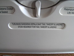Lifejacket instructions on back of seat in Garuda 737-800