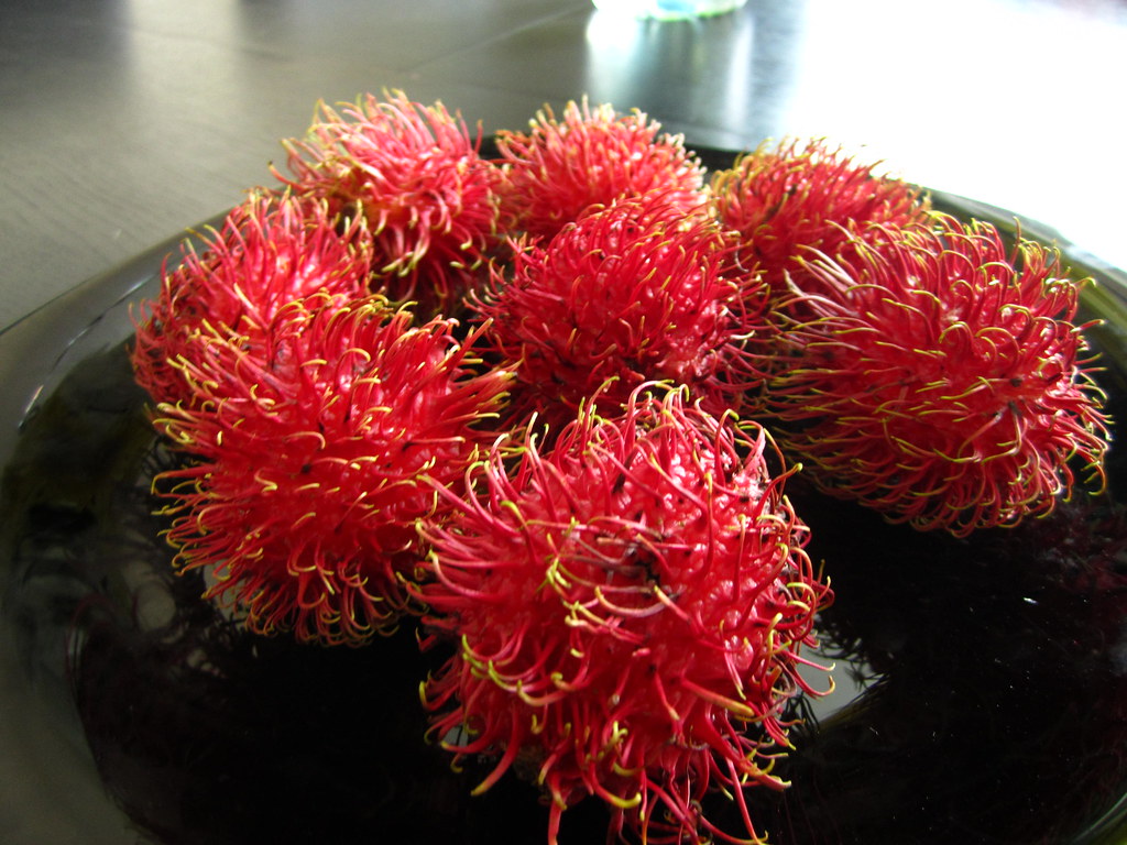 red spiky exotic fruit | rambutan fruit (nephelium lappaceum… | flickr