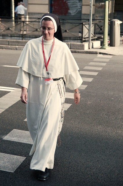 Nun crossing the street