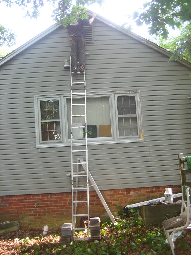 roof - soffit painting - 0 - Clint up on ladder - cinder b… | Flickr
