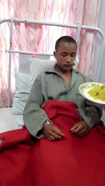 Tenzin Dakpa recovers at the Tenga Millitary Hospital.jpg