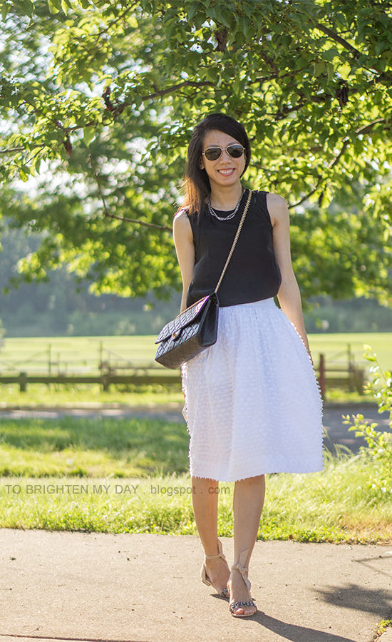 black silk sleeveless top, white midi skirt, black crossbody bag, suede and jeweled sandals