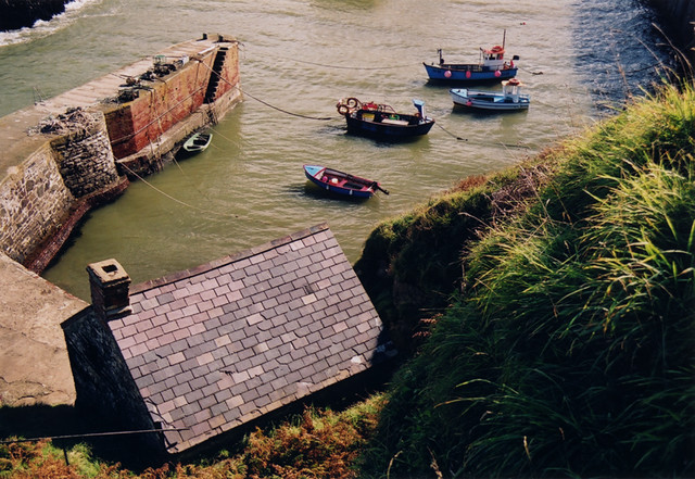 Boats in a harbour, one of the sights along the Pembrokeshire Coastal Path in Wales