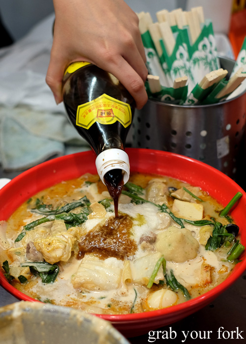 Adding Chinkiang black vinegar to our malatang at Yang Guo Fu Ma La Tang, Haymarket