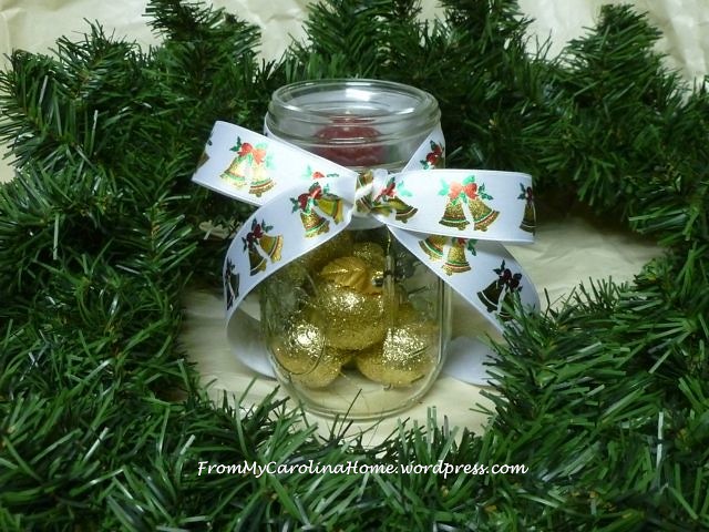 Mason jar with votive, gold apples, bow
