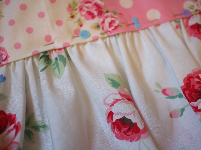 one pink frilly apron