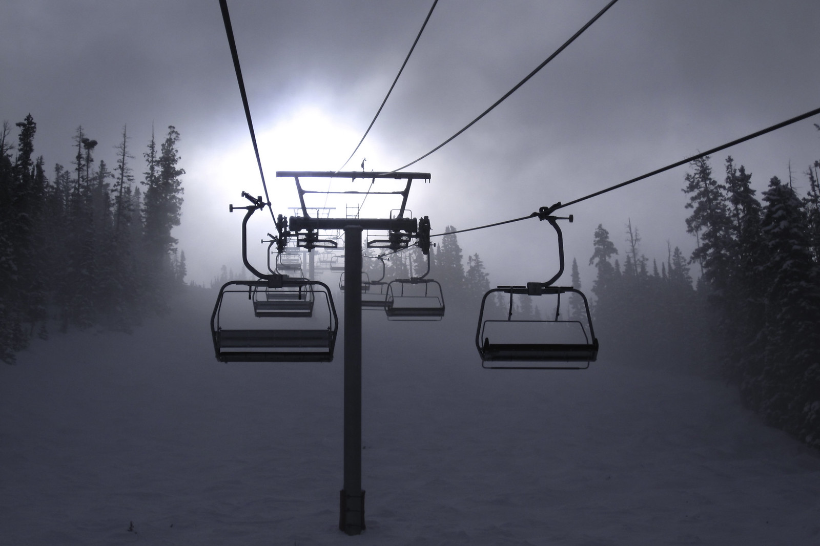 Ski chairlift taking you into the clouds. Beaver Creek, Colorado. By