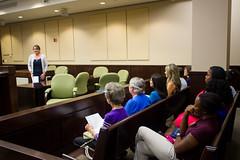 New volunteers and guests listen to Deborah Moore speak during the guardian ad litem swearing in ceremony at the Leon County Courthouse in Tallahassee, Florida on September 28, 2012.