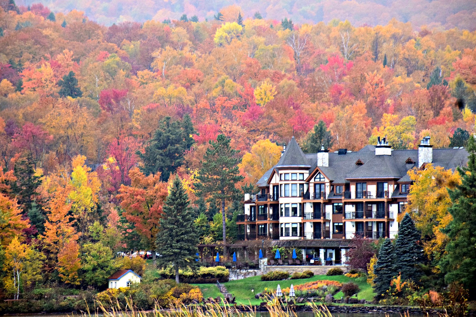 fall getaways in central Canada. Brilliant fall color at Hotel Quintessence in Mont-Tremblant, Quebec, where you'll find some of the best fall foliage in Canada.