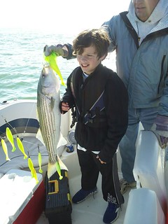 Photo of Boy with a nice striped bass