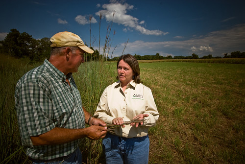 A farmer with a NRCS employee