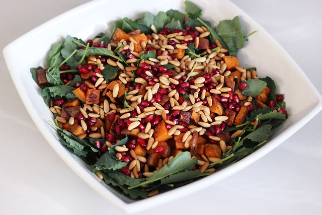 Baby Kale and Roasted Sweet Potato Salad with Pomegranate and Toasted Pine Nuts