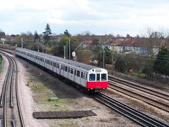 AN UNREFURBISHED D STOCK TRAIN APPROACHES ELM PARK STATION