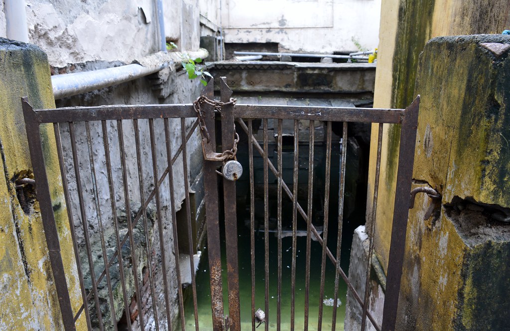 The stepwell filled with water near Ayurveda Hospital.
