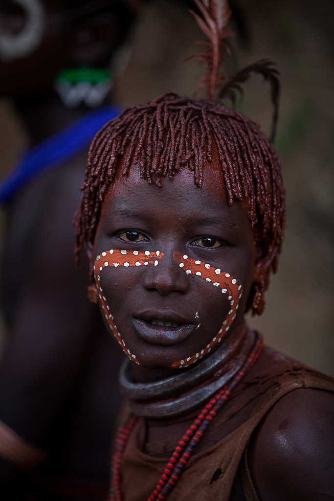 hamer tribe paint their faces during the ceremony bull jum 