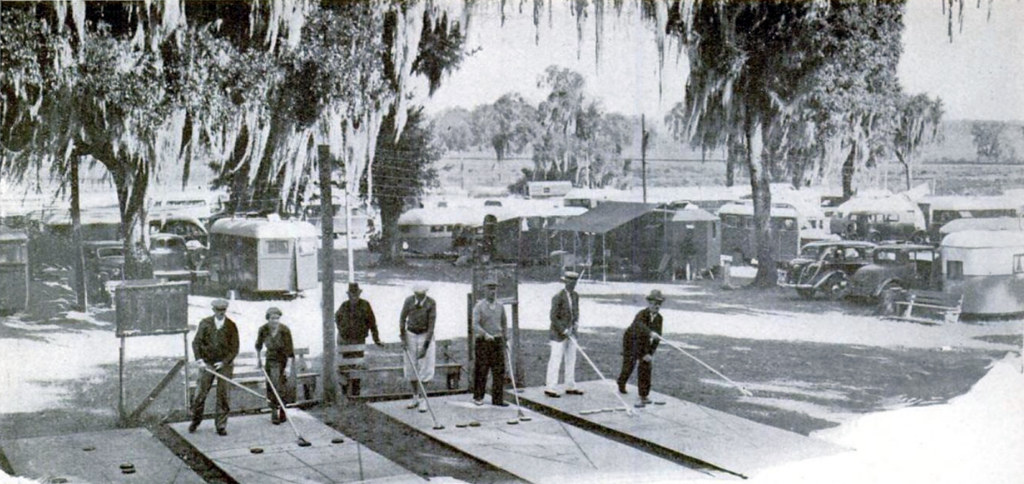 "Tin-can tourists" playing shuffleboard at the large municiple trailer camp in Dade City, Fla. - Popular Science, April 1937