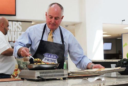Administrator Dolcini serving as sous chef