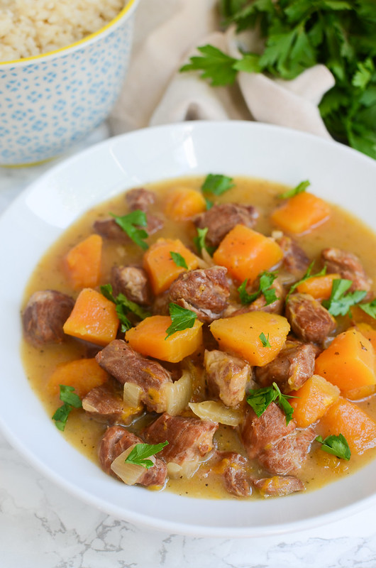 Slow Cooker Pork and Butternut Squash Stew - a bowl of comfort! Quickly brown the pork and then toss everything in the slow cooker! 