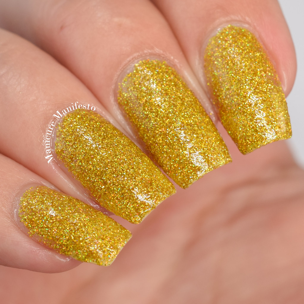 Yellow glitter nail polish