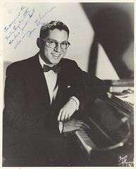 Tom Lehrer - seated at piano - signed "To everyone at the Theatre Royal - with thanks and sincere best wishes - Tom Lehrer