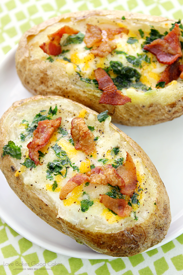 Bacon & Egg Stuffed Baked Potatoes on a white plate close up.